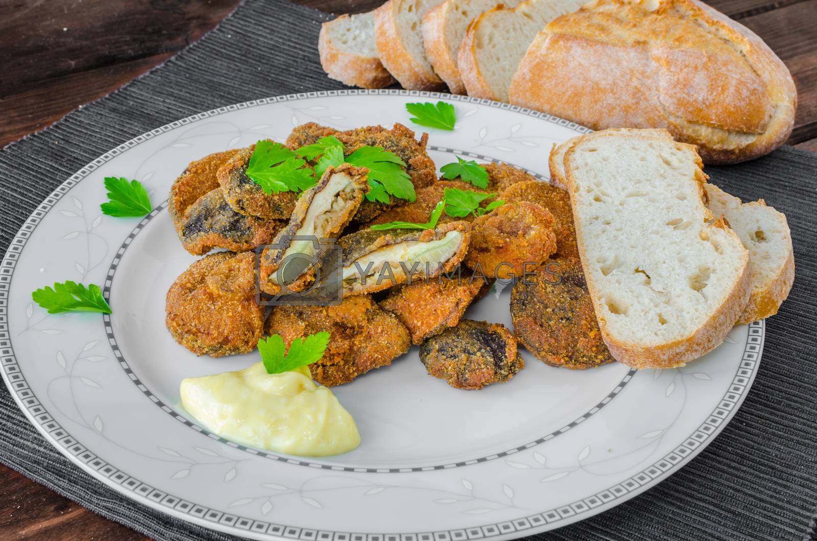 Royalty free image of Breaded and fried mushrooms with homemade mayonnaise by Peteer