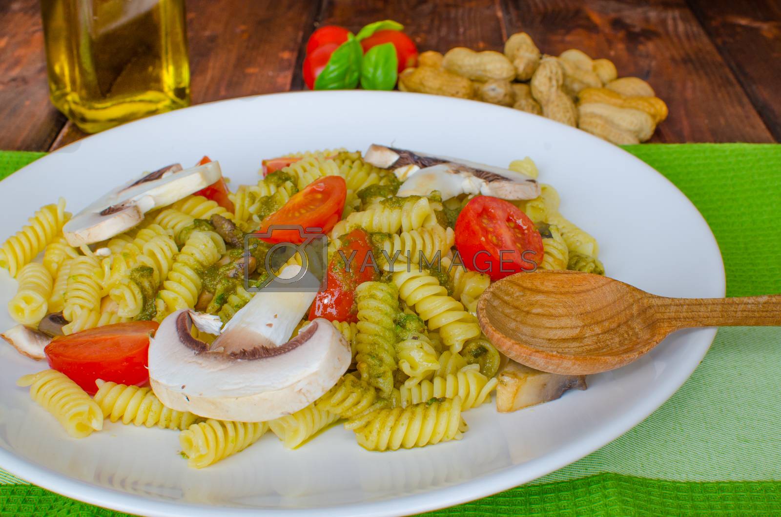 Royalty free image of Pasta with basil pesto, nuts and mushrooms by Peteer