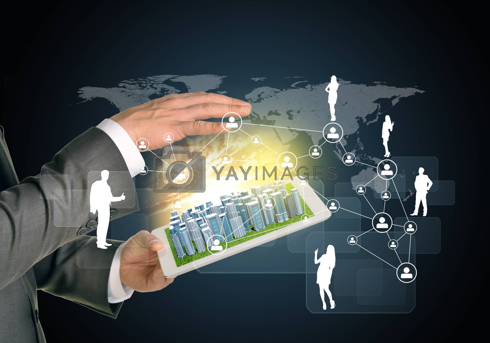 Royalty free image of Man hands using tablet pc. Business city on touch screen. Network with business silhouettes near computer by cherezoff