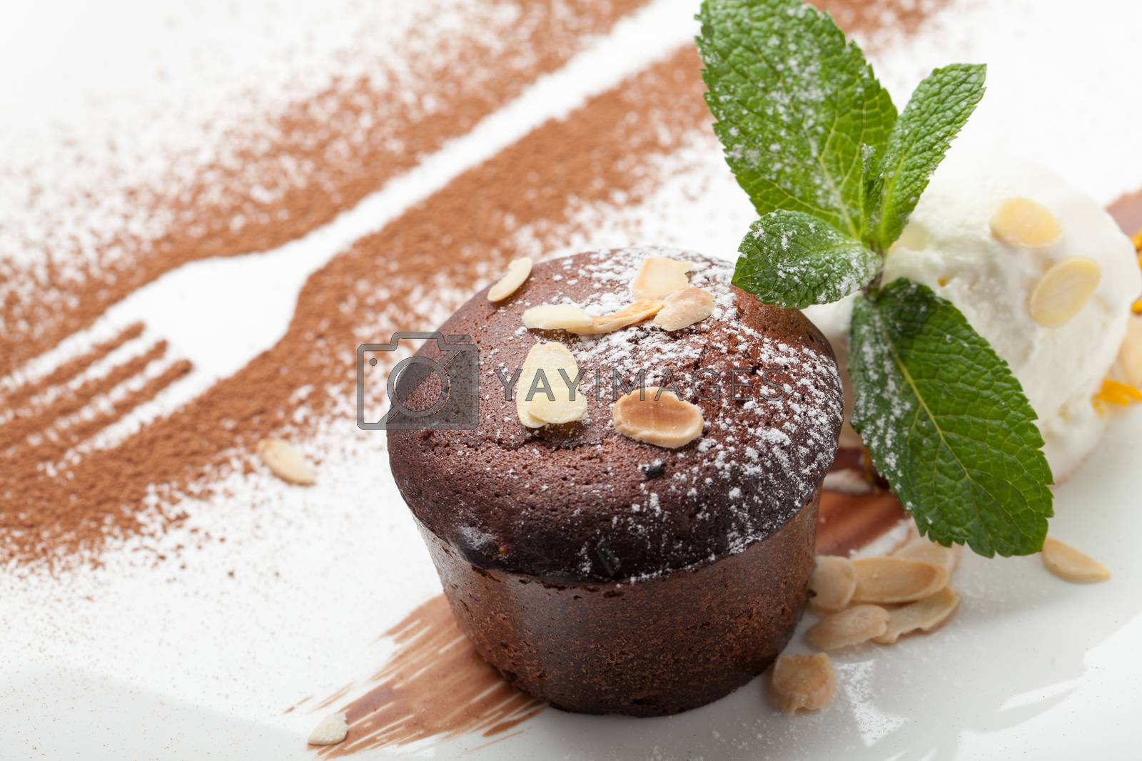 Royalty free image of Warm chocolate cake Fondant with ice-cream ball, almond, mint, c by SergeyAK