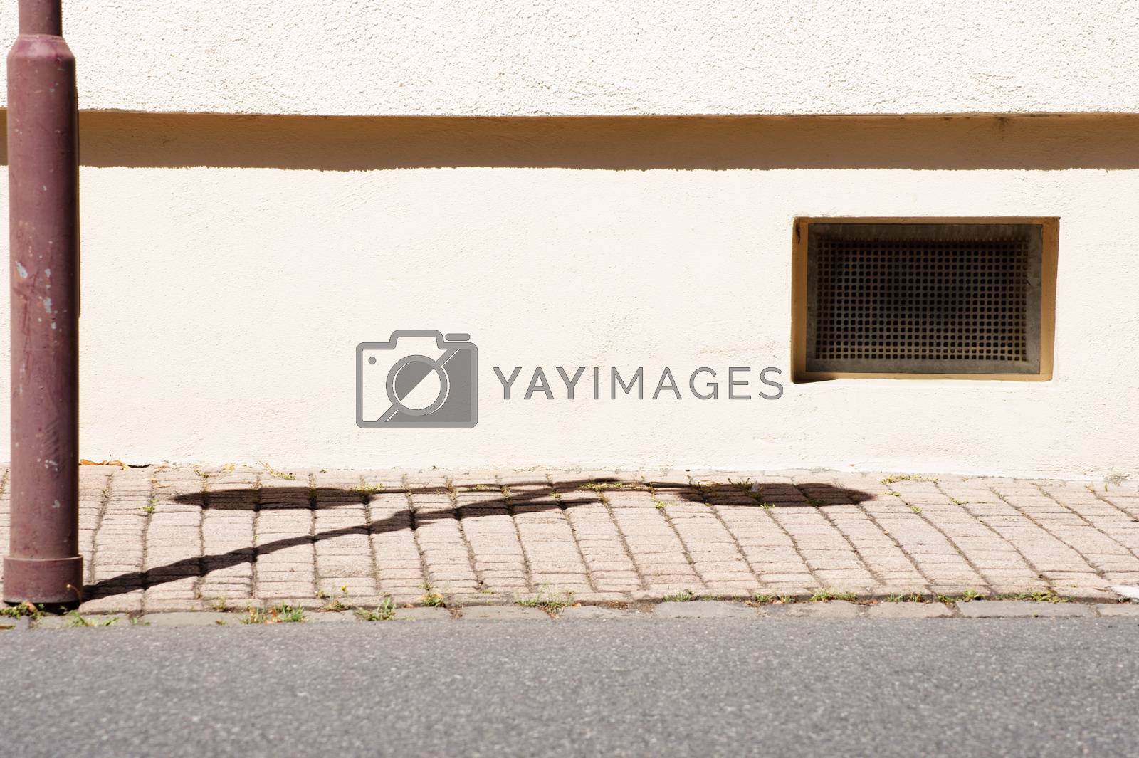 Royalty free image of Basement window with lantern shade by ginton