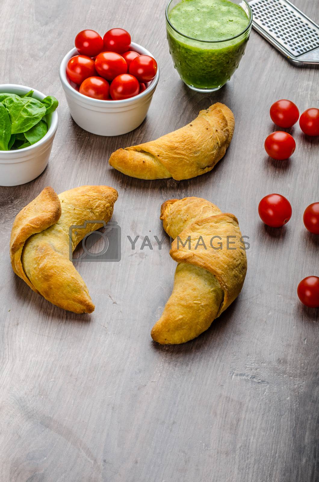 Royalty free image of Mini Calzone roll with herbs and cheese by Peteer