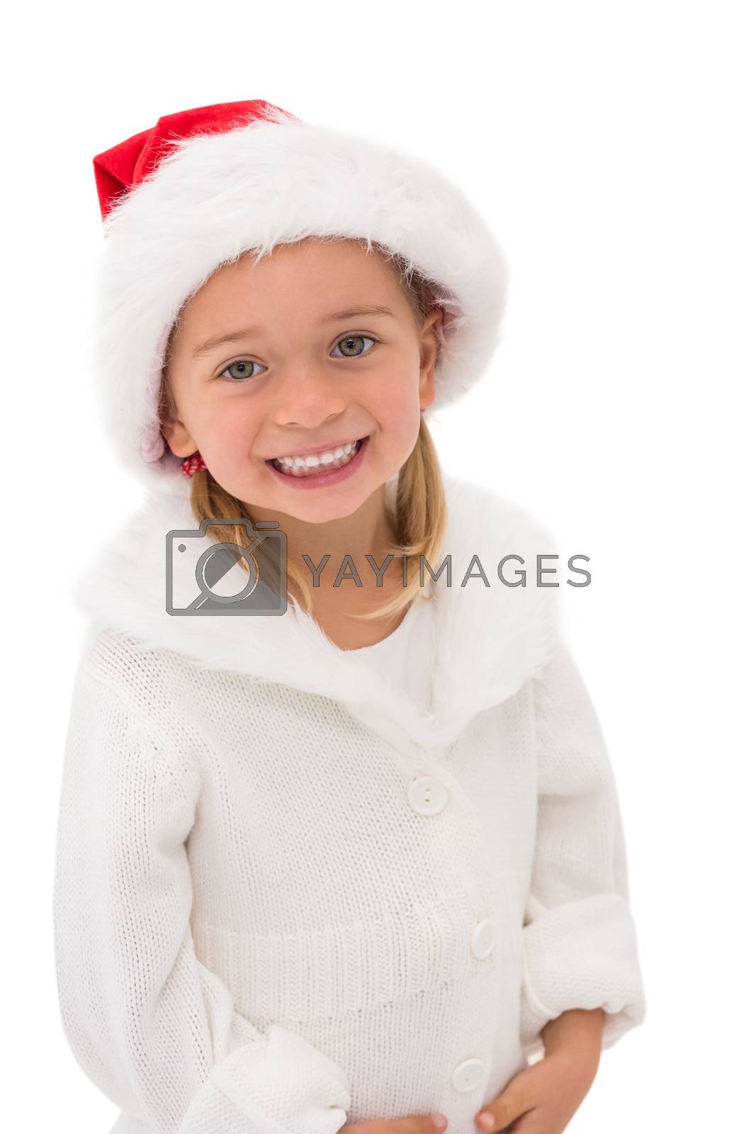 Royalty free image of Cute little girl wearing santa hat  by Wavebreakmedia