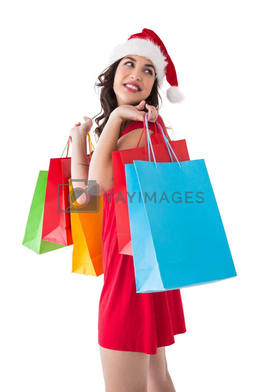 Royalty free image of Smiling brunette holding shopping bags  by Wavebreakmedia