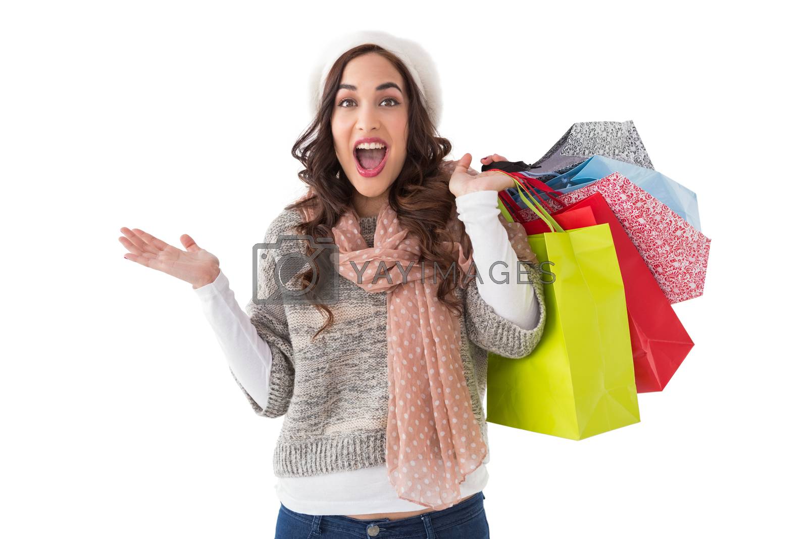 Royalty free image of Excited brunette with shopping bags by Wavebreakmedia