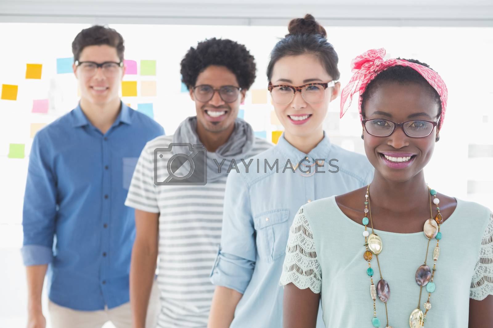 Royalty free image of Young creative team smiling at camera by Wavebreakmedia