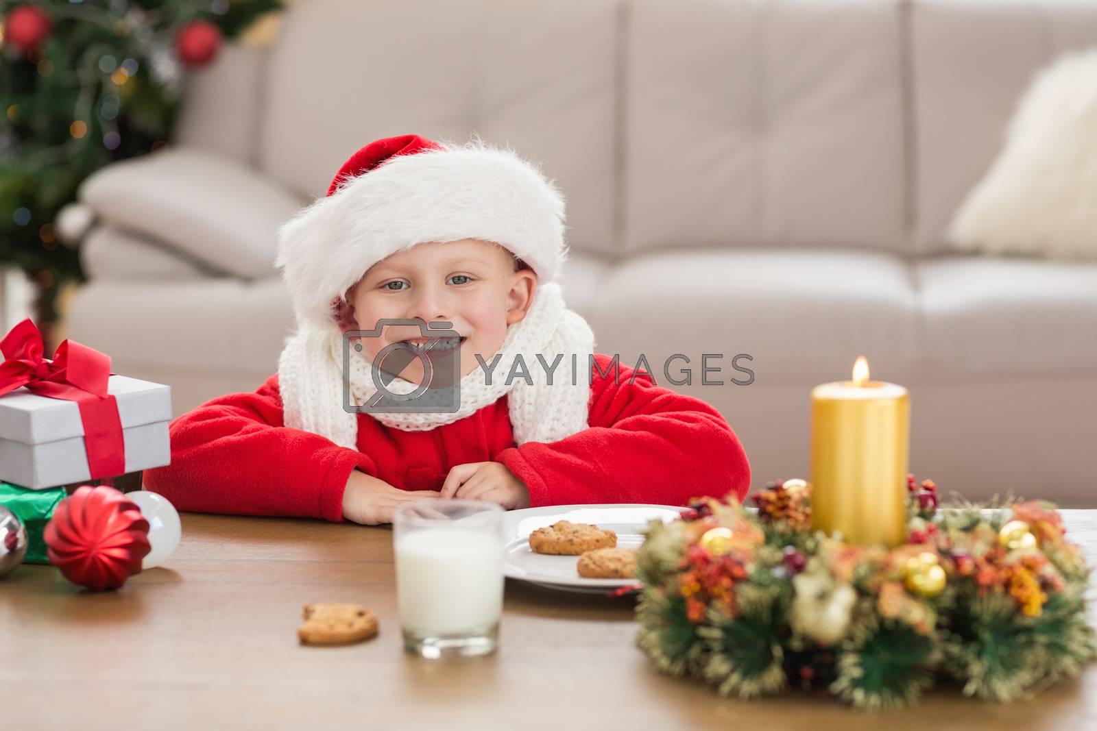 Royalty free image of Festive little boy smiling at camera  by Wavebreakmedia