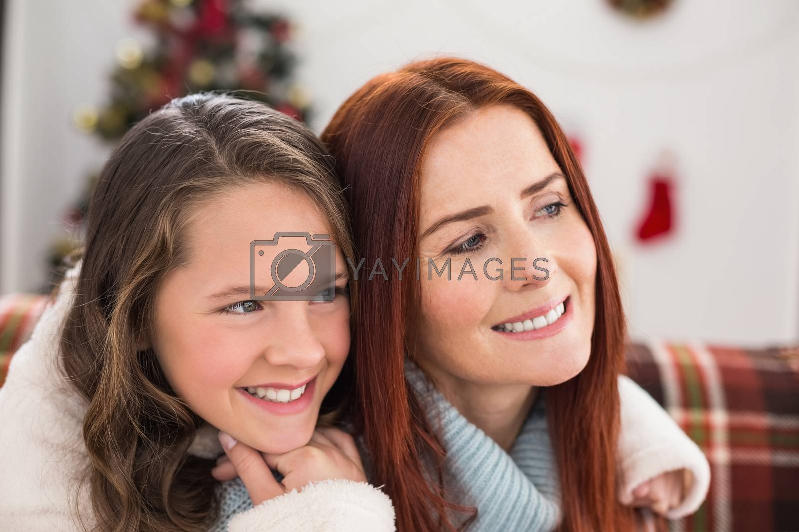 Royalty free image of Festive mother and daughter on the couch by Wavebreakmedia