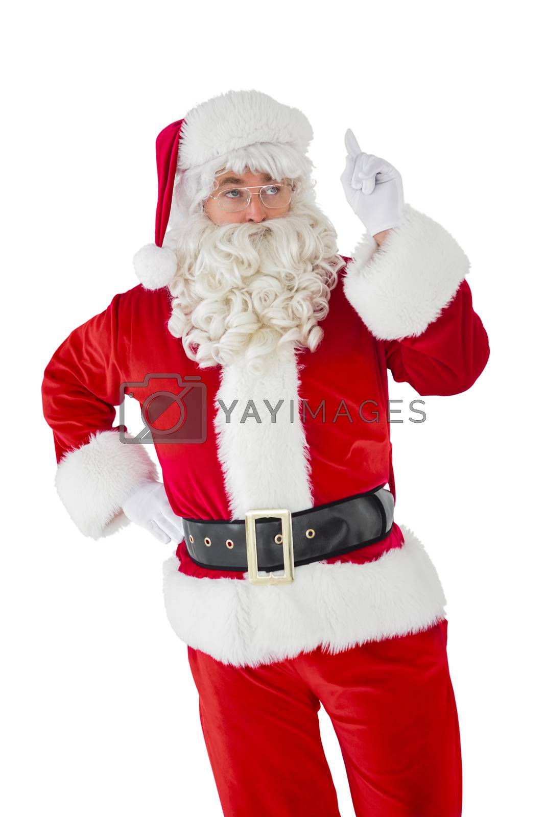 Royalty free image of Serious santa claus pointing his finger by Wavebreakmedia