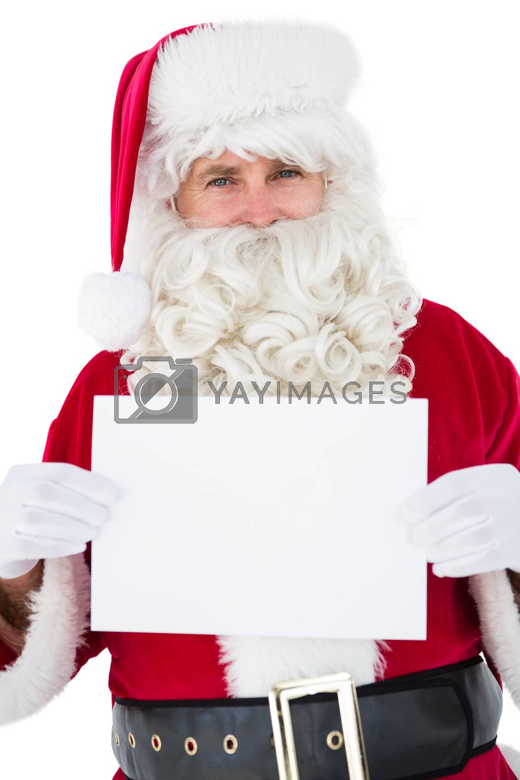 Royalty free image of Cheerful santa claus holding page by Wavebreakmedia