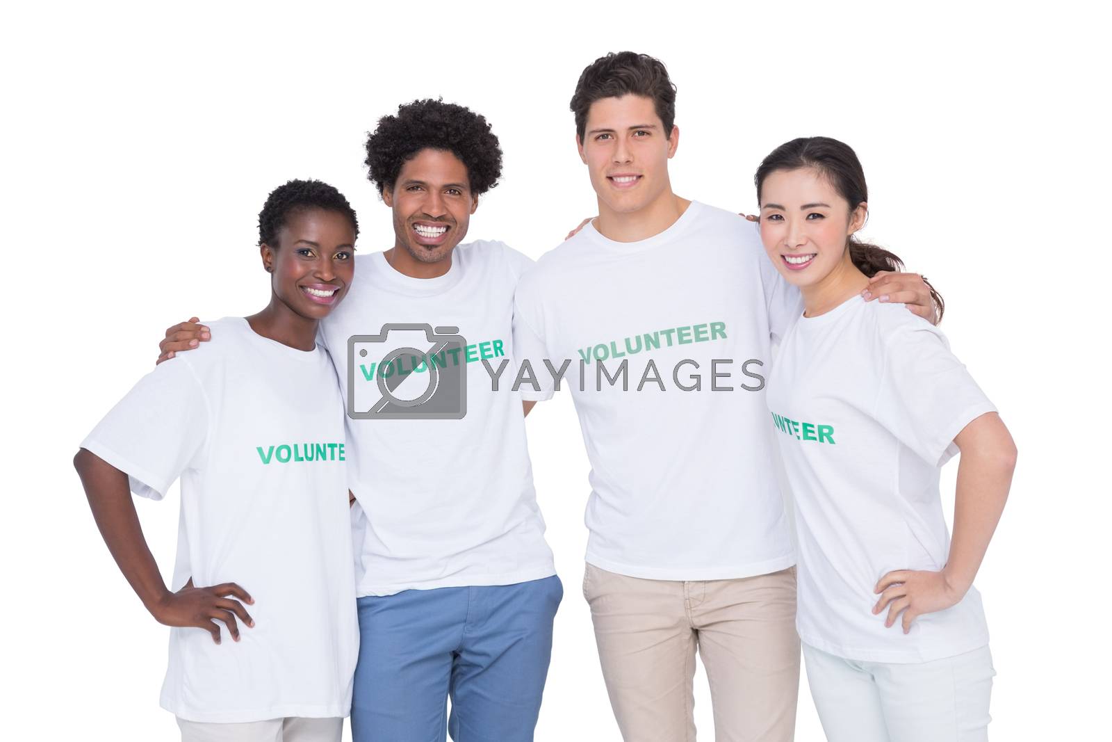 Royalty free image of Young smiling volunteers looking at camera by Wavebreakmedia