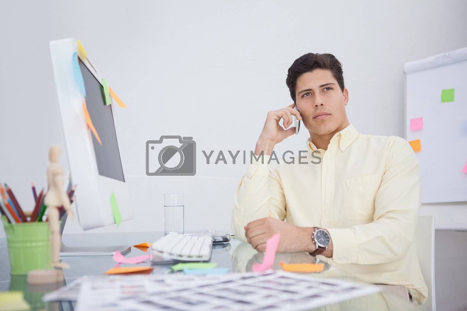Royalty free image of Serious businessman on the phone by Wavebreakmedia