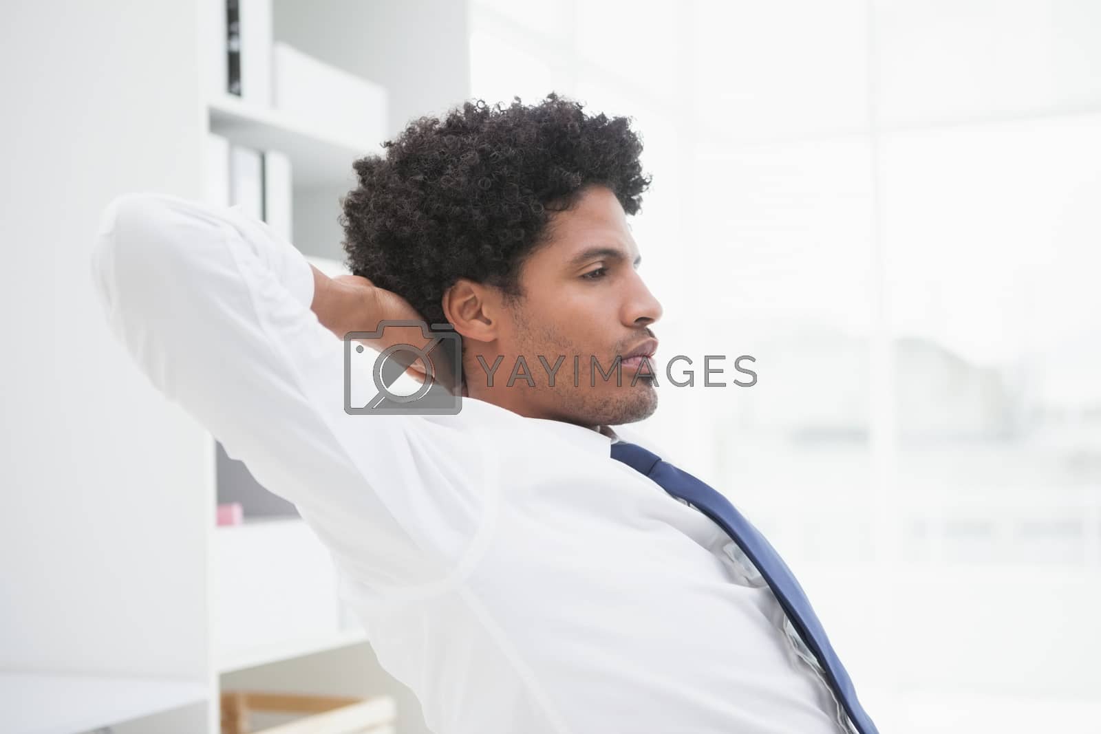 Royalty free image of Peaceful businessman relaxing at work by Wavebreakmedia