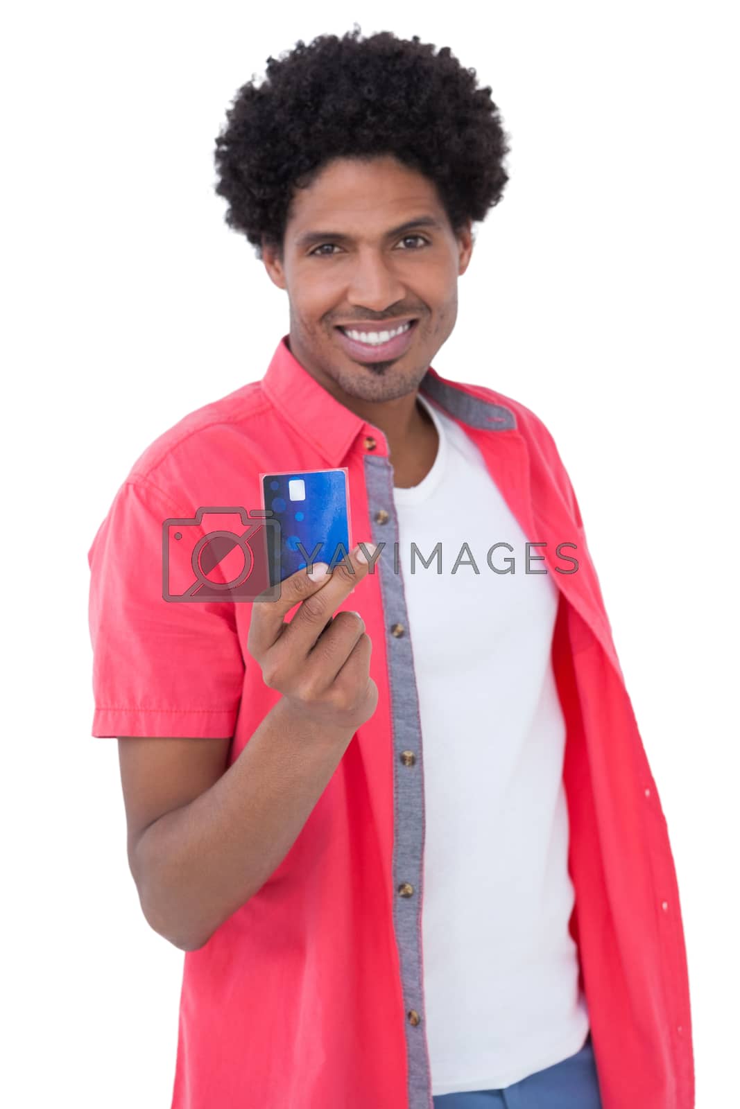 Royalty free image of Happy man holding credit card by Wavebreakmedia