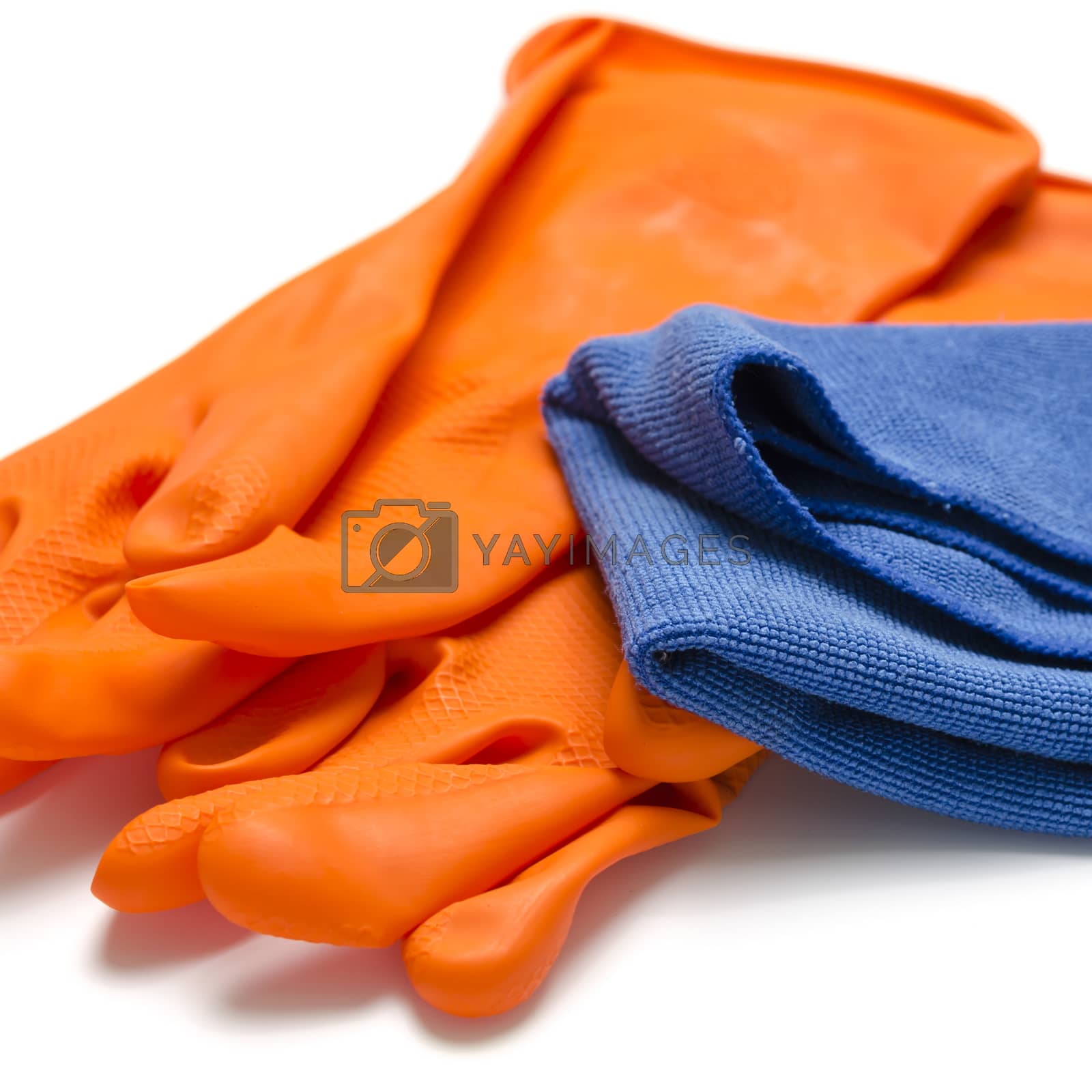 Royalty free image of blue rag with orange cleaning glove by ammza12