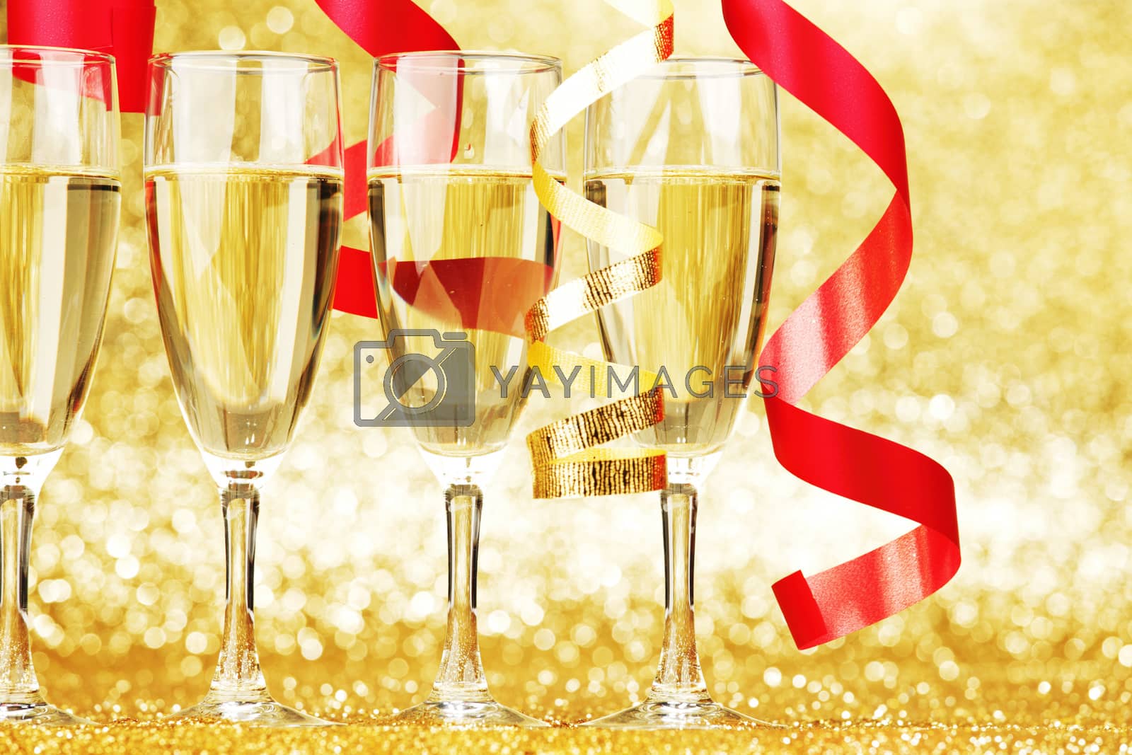 Royalty free image of Champagne and ribbons by Yellowj