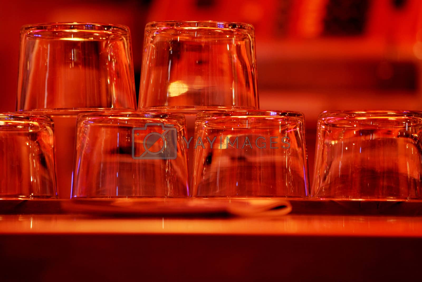 Royalty free image of Upturned wine glasses in restaurant bar close-up by edwardolive