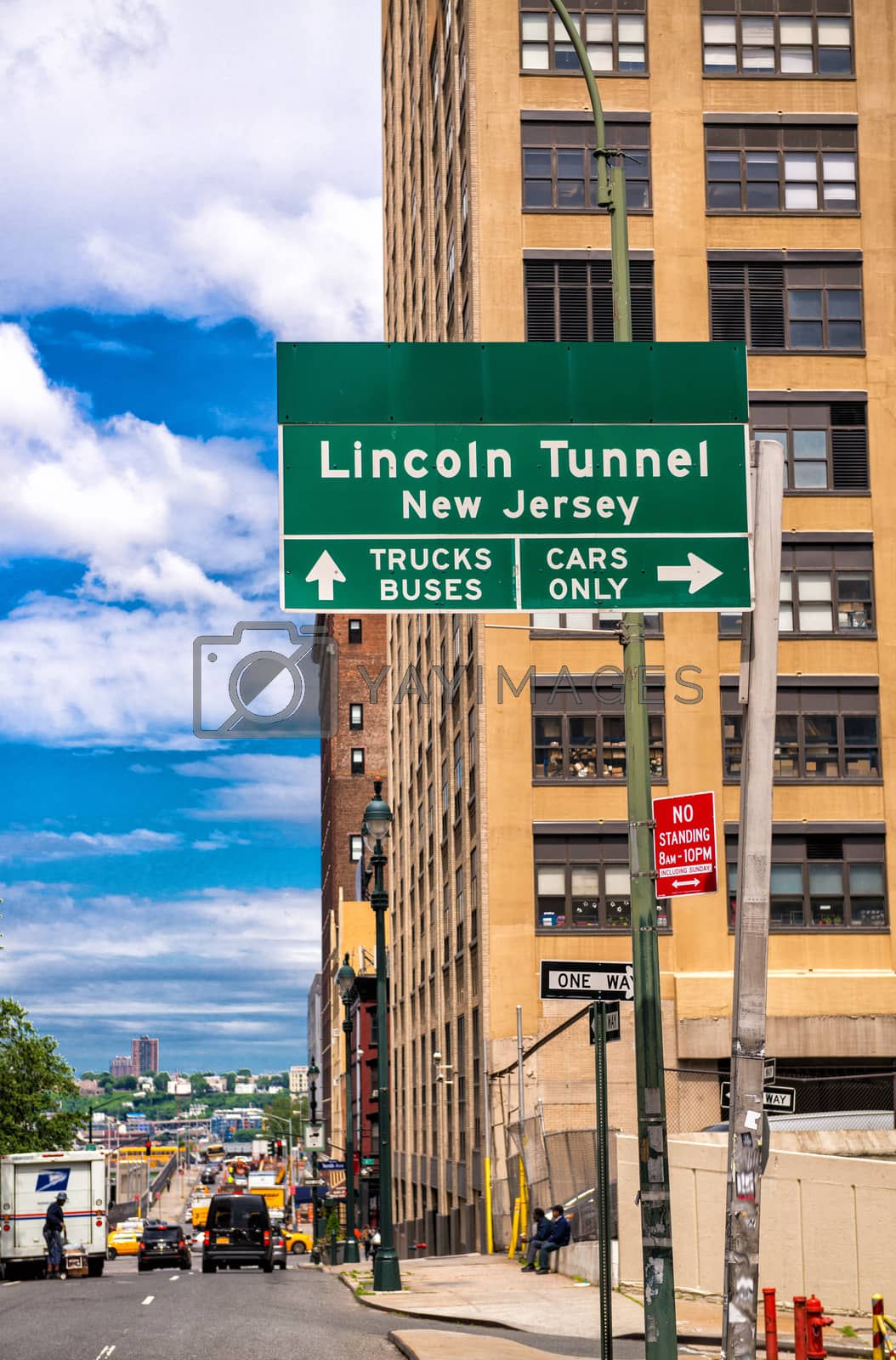 Royalty free image of Lincoln Tunnel signage in Manhattan with city skyline by jovannig