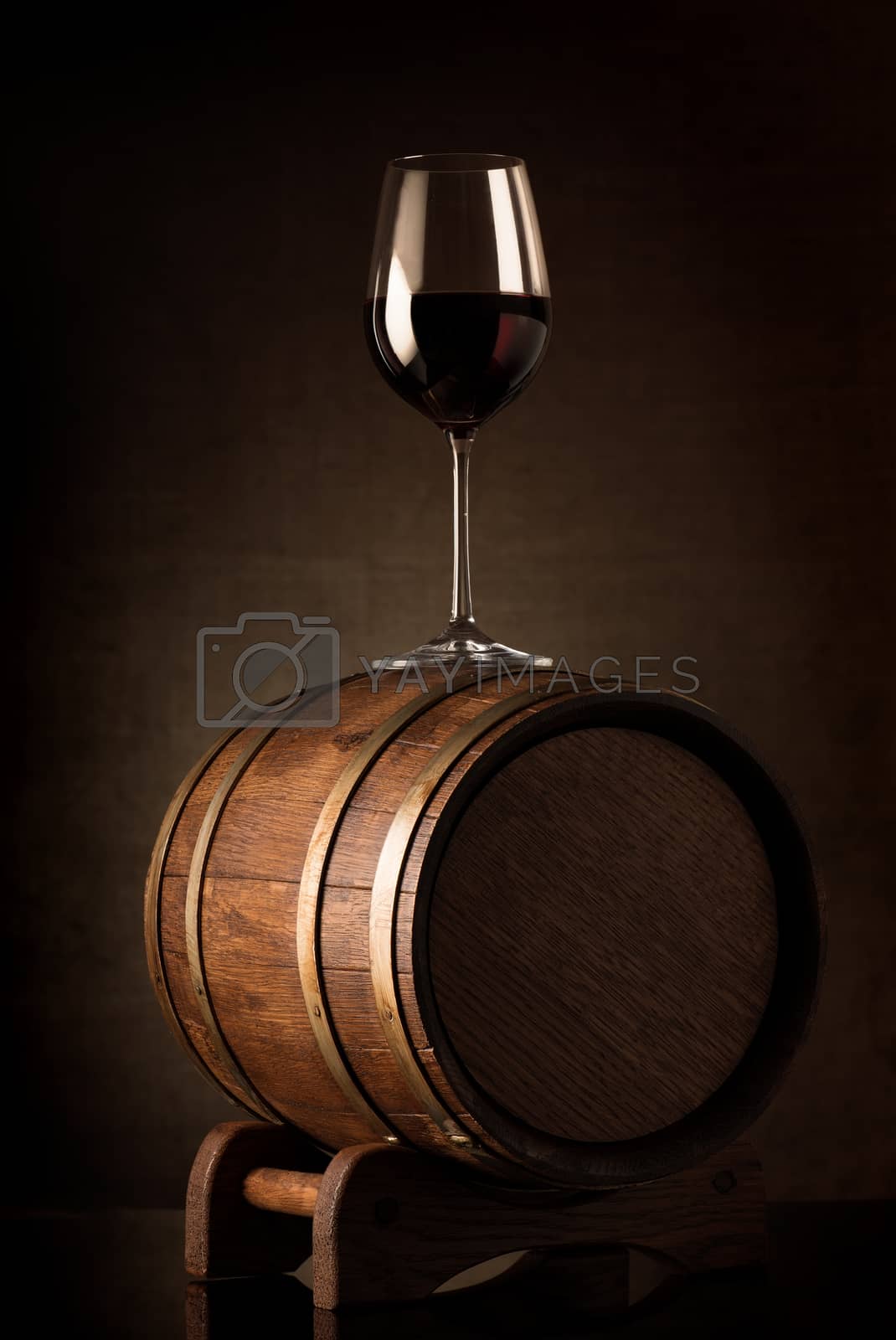 Royalty free image of Wine on barrel by Givaga
