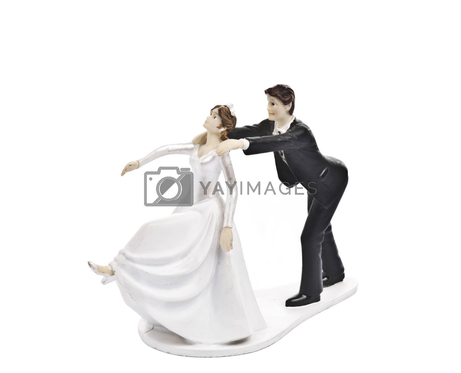 Royalty free image of Couple wedding cake topper isolated on white by marius_dragne