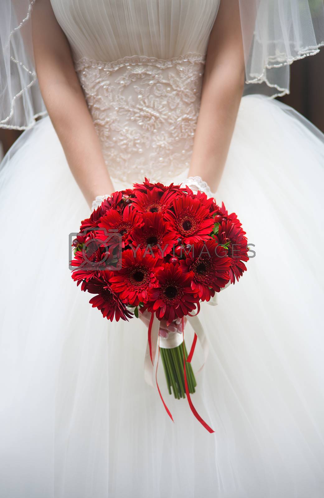 Royalty free image of wedding bouquet in hands of the bride. by sfinks