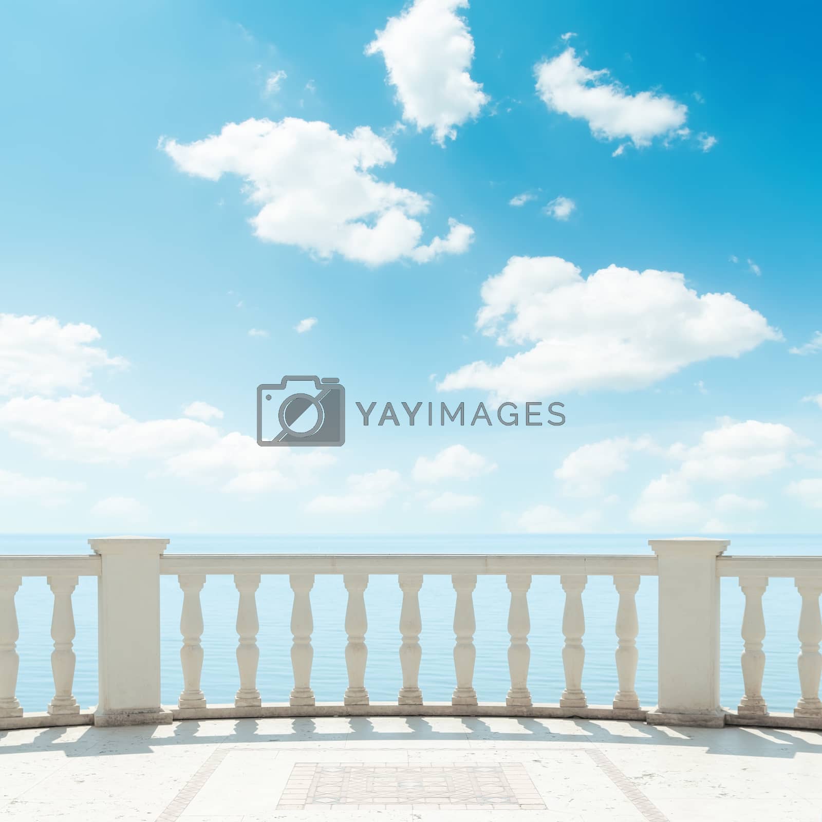 Royalty free image of clouds in blue sky over balcony by mycola