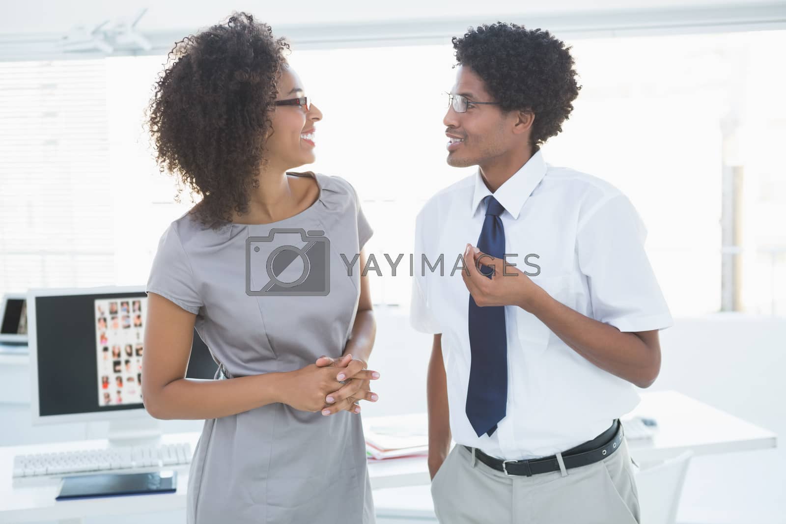 Royalty free image of Young editorial team talking together by Wavebreakmedia