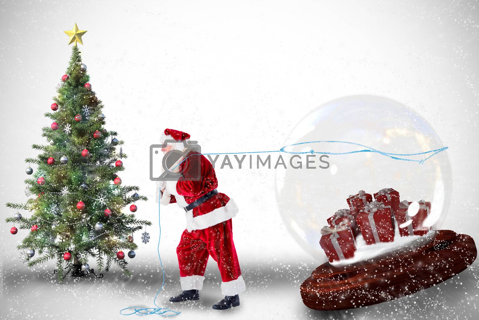 Royalty free image of Composite image of santa pulling snow globe of presents by Wavebreakmedia