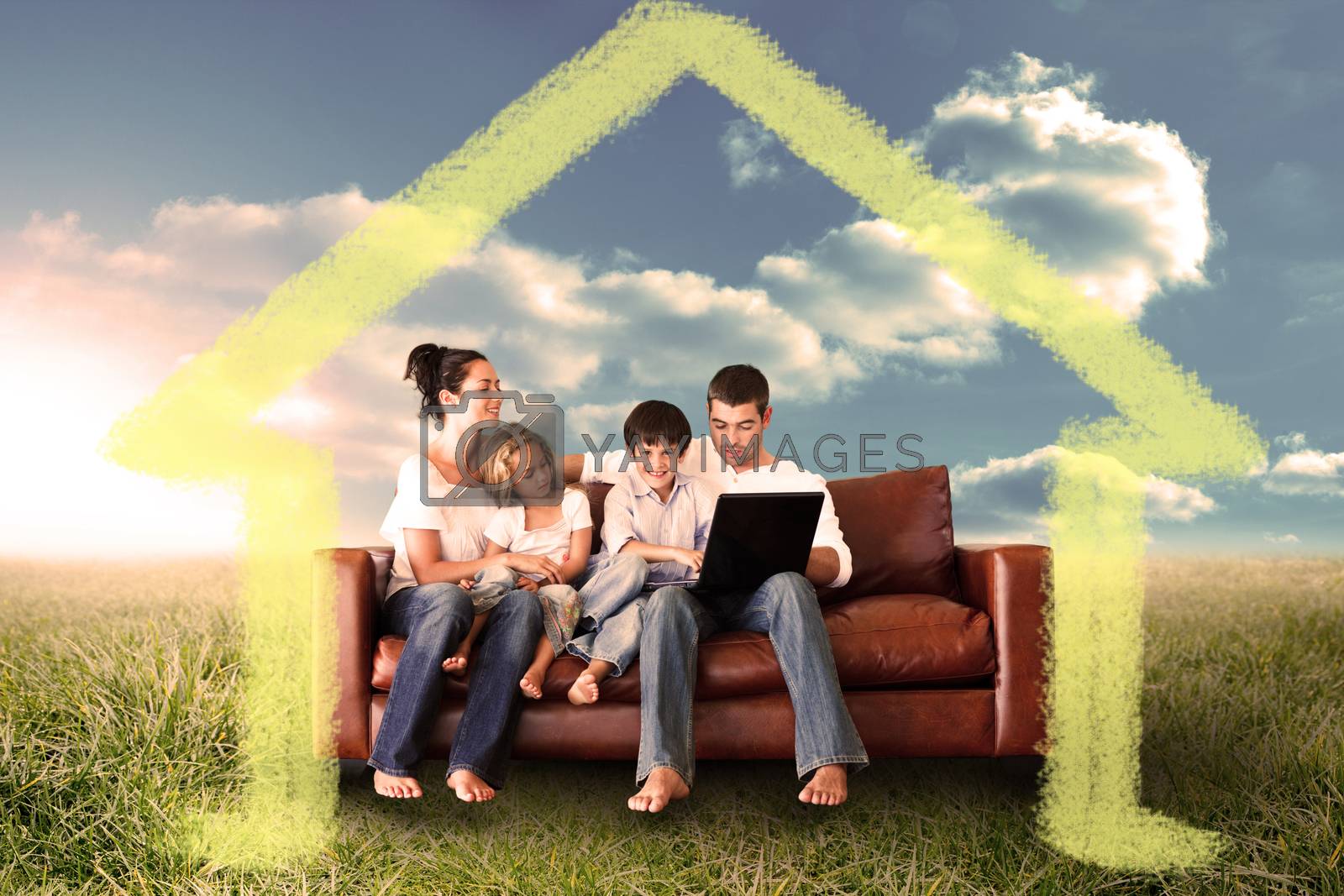 Royalty free image of Composite image of happy family using the laptop in a field by Wavebreakmedia