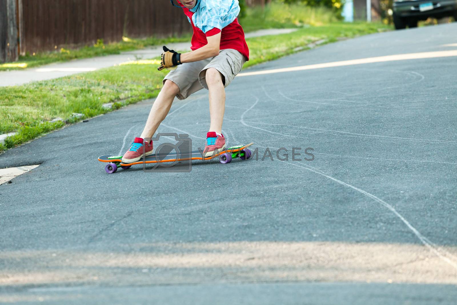 Royalty free image of Longboarder Teen by graficallyminded