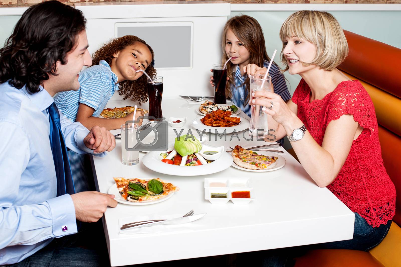 Royalty free image of Family eating together in hotel. by stockyimages
