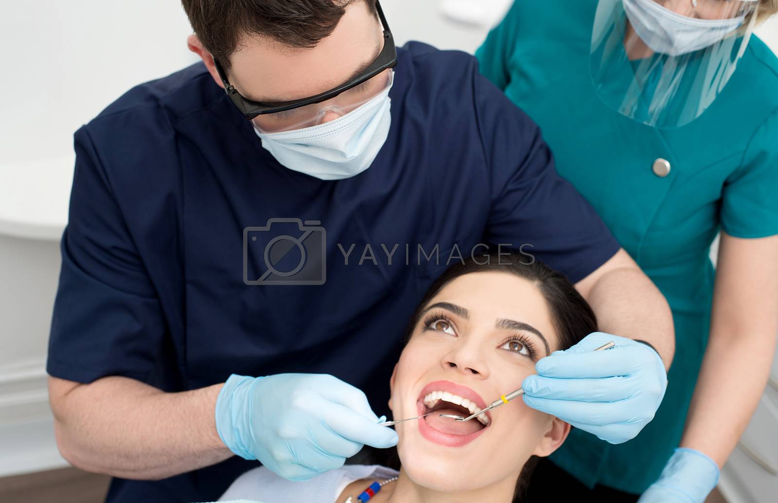 Royalty free image of Woman patient undergoing a dental check by stockyimages
