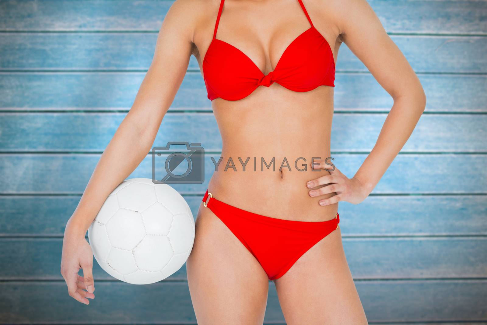 Royalty free image of Composite image of fit woman in bikini by Wavebreakmedia