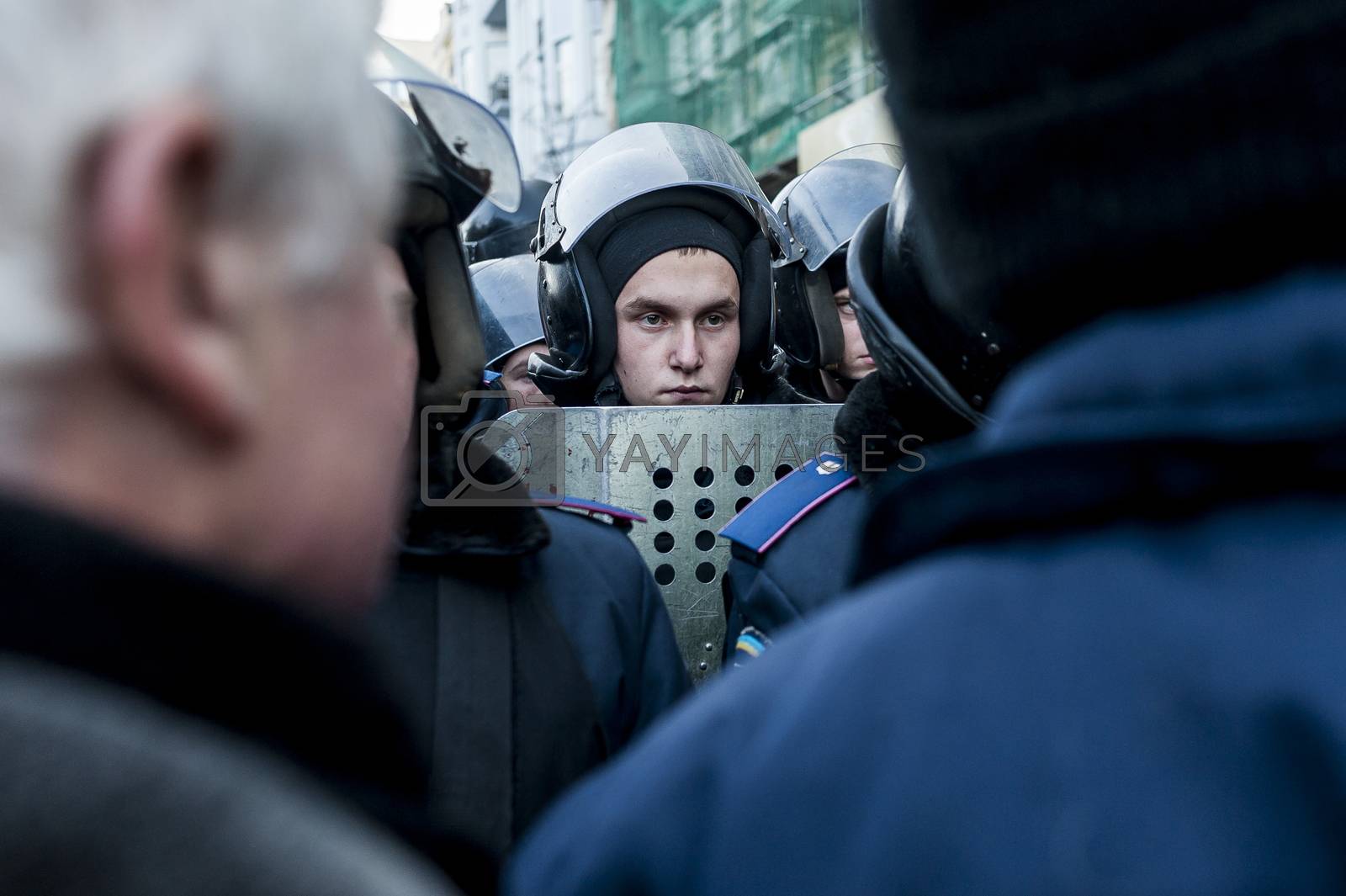 Royalty free image of Maidan - young police guard in stand-off against protesters by marcnim