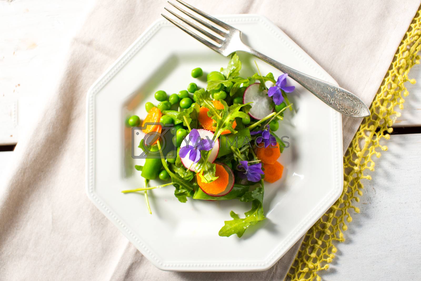 Royalty free image of Spring salad with peas and carrots by Boyrcr420