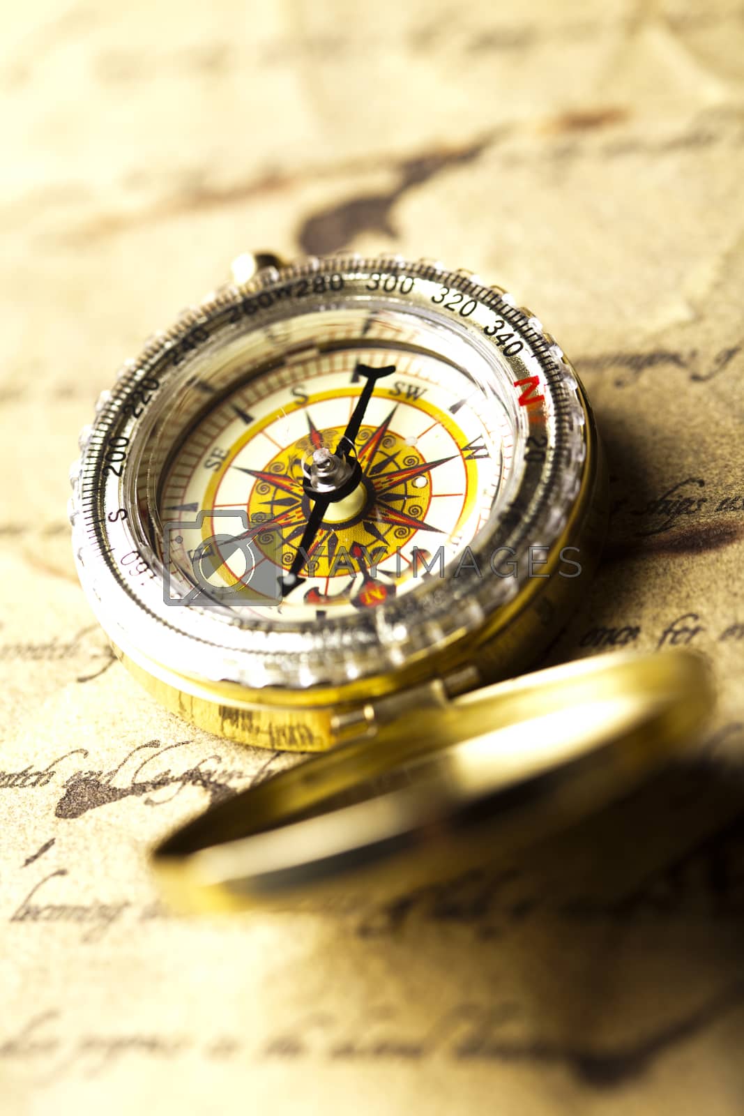 Royalty free image of Traveling, Compass, ambient light travel theme by JanPietruszka