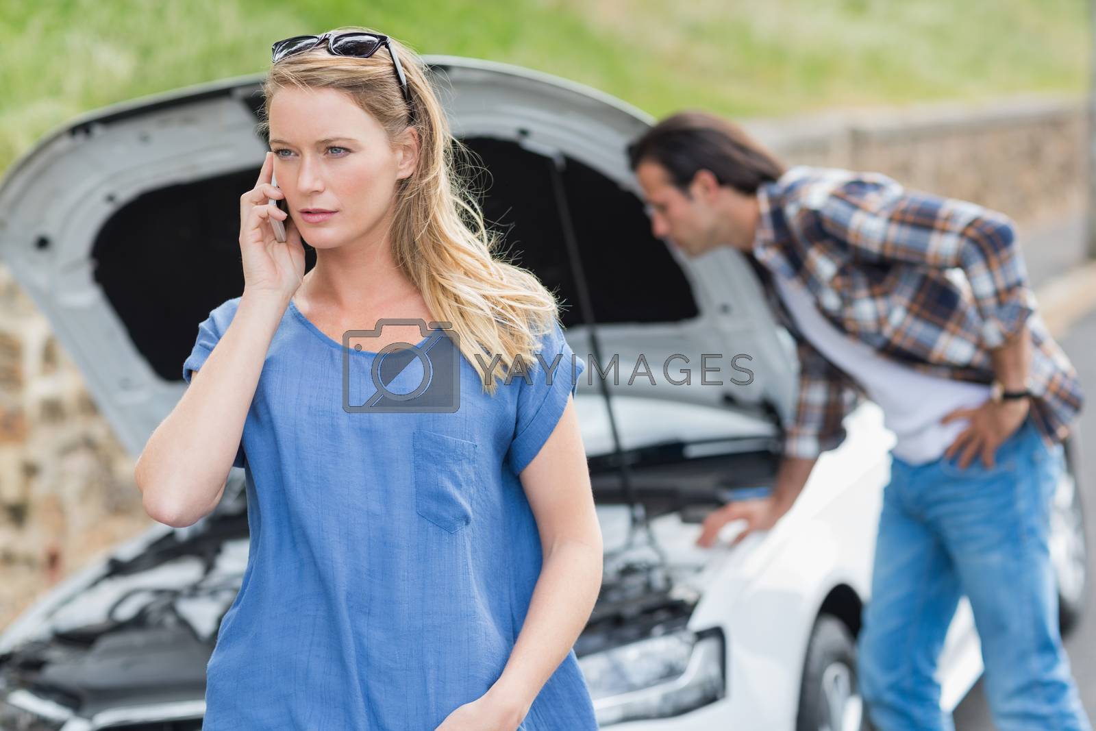 Royalty free image of Couple after a car breakdown by Wavebreakmedia