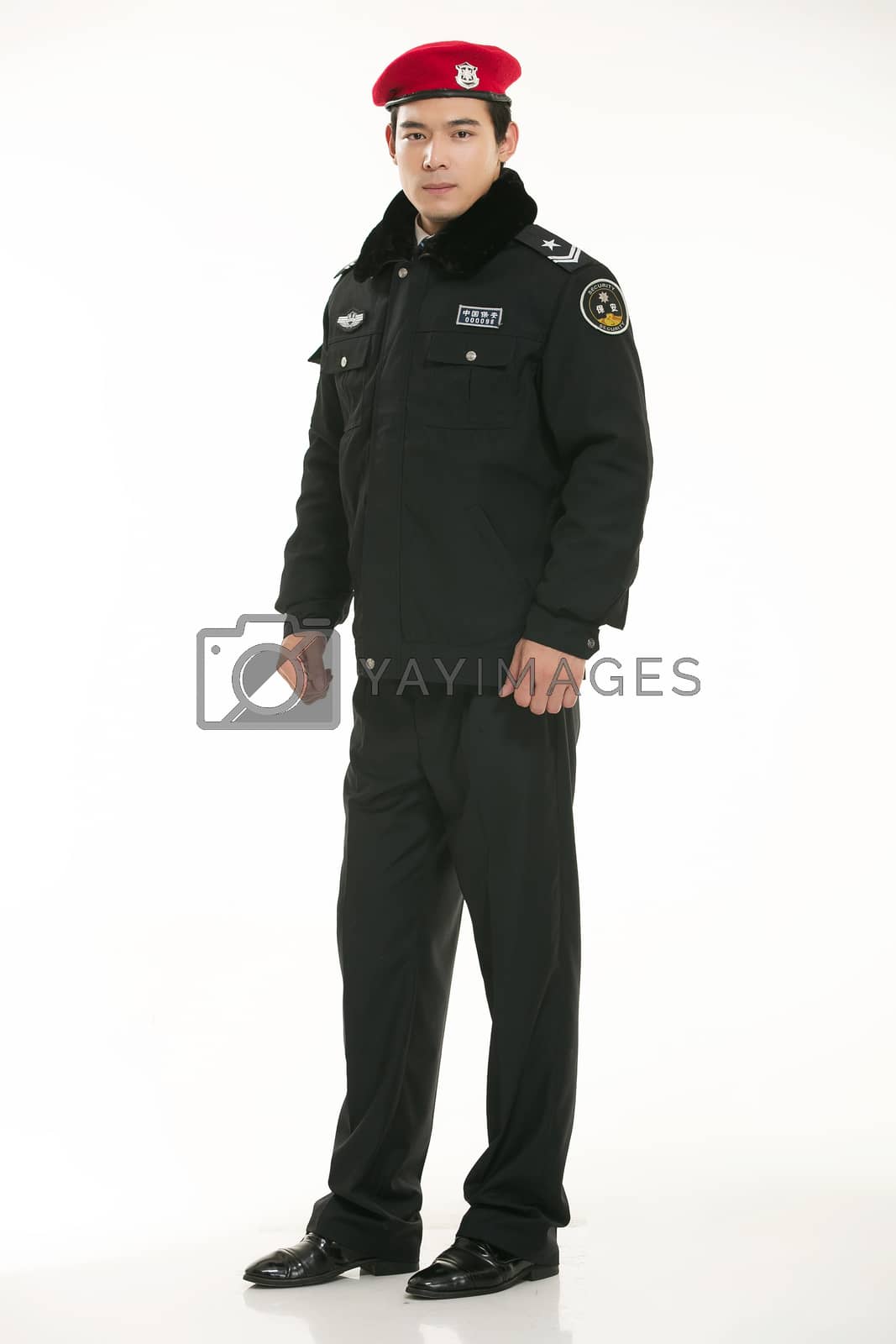 Royalty free image of Create all kinds of work clothes policeman stands in front of a white background by quweichang
