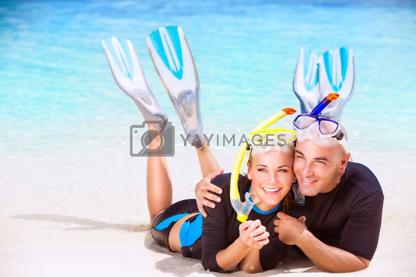 Royalty free image of Happy couple enjoys beach activities by Anna_Omelchenko