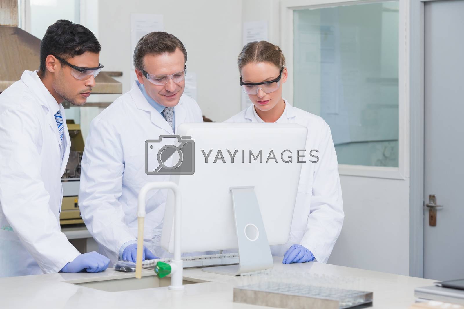 Royalty free image of Scientists working on computer together  by Wavebreakmedia