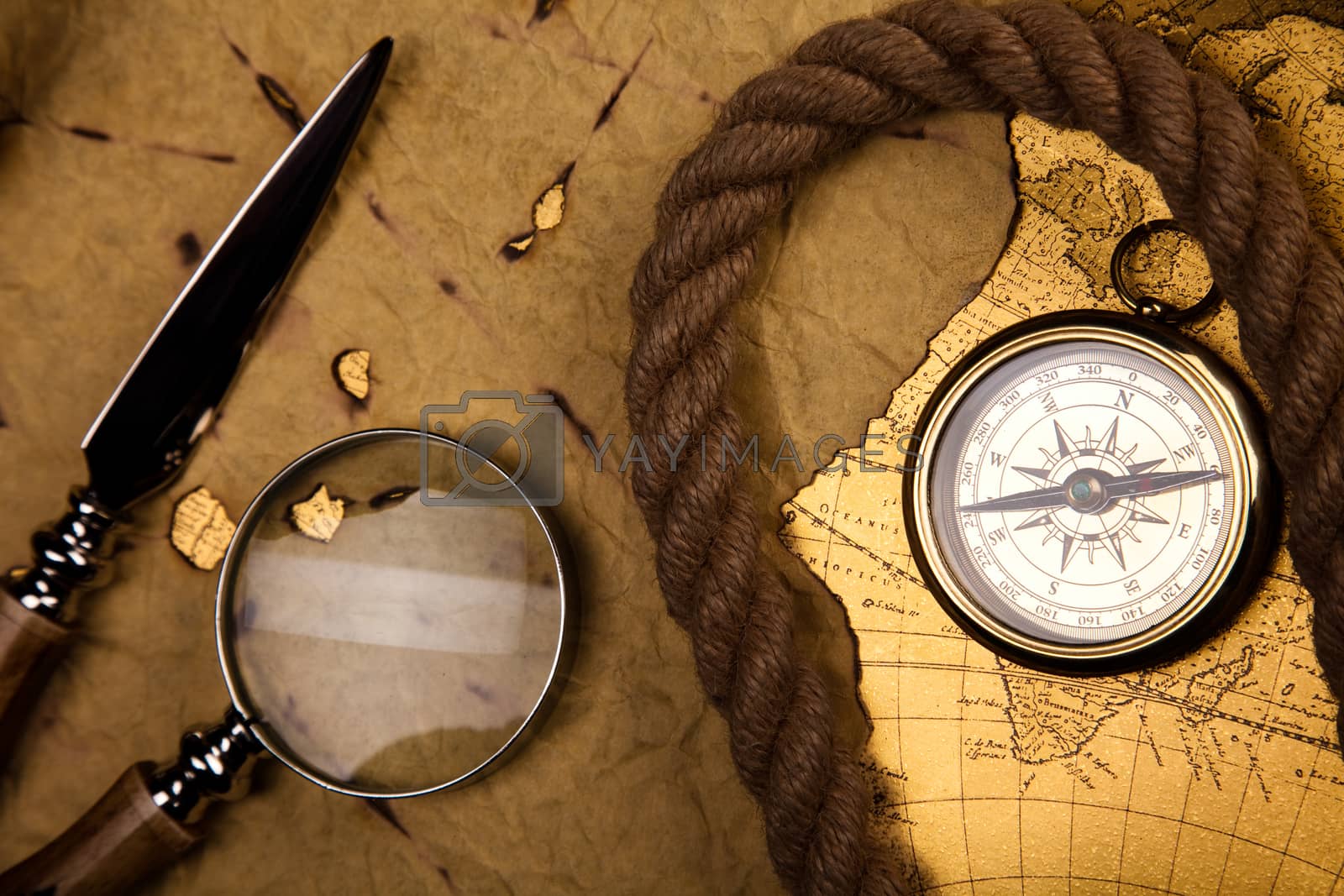 Royalty free image of Magnifying glass & Compass, colorful bright journey theme by JanPietruszka