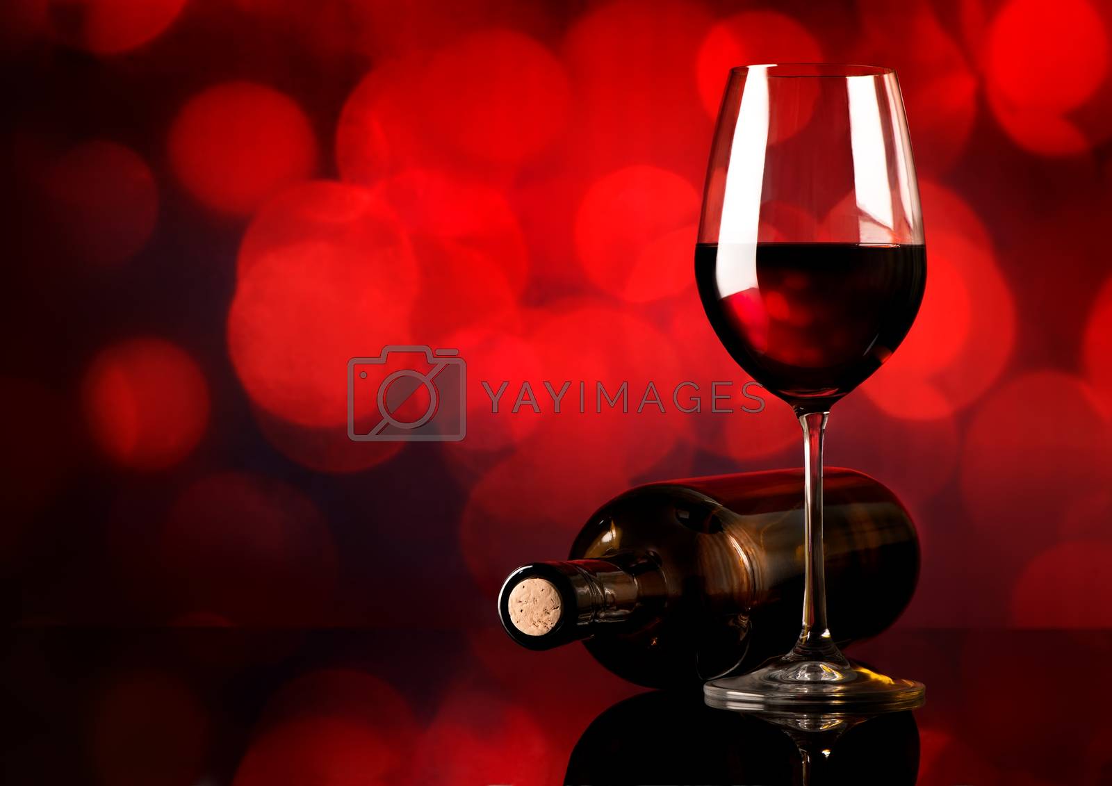 Royalty free image of Red wine on red background by Givaga