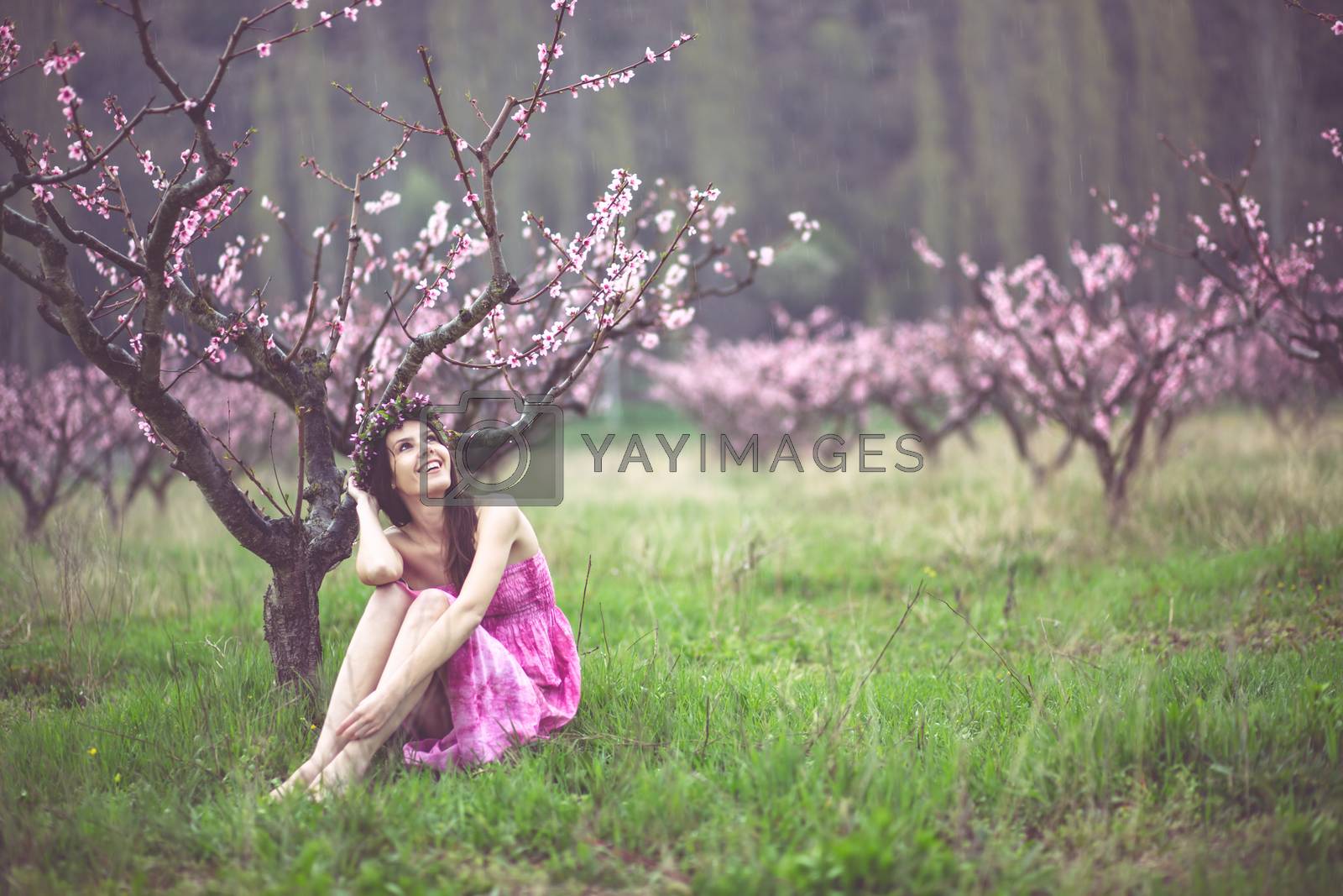 Royalty free image of Woman in spring garden by alenkasm