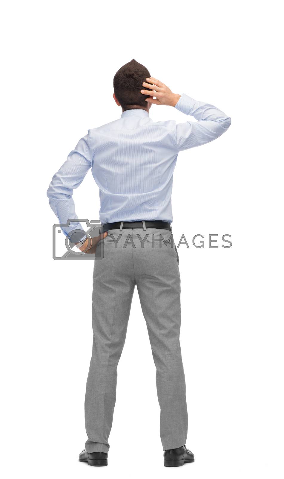 Royalty free image of businessman scratching his head from back by dolgachov