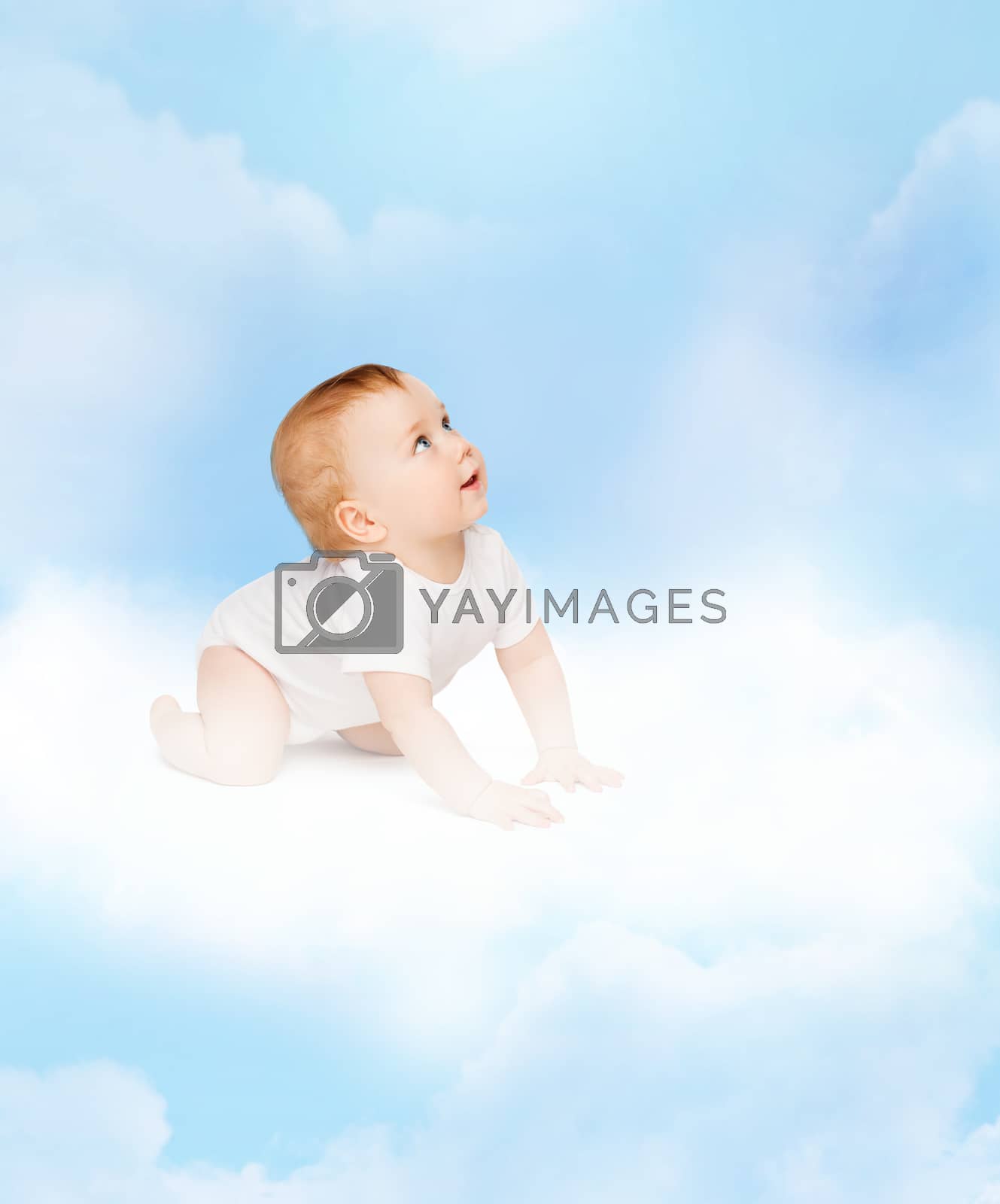 Royalty free image of crawling curious baby looking up by dolgachov