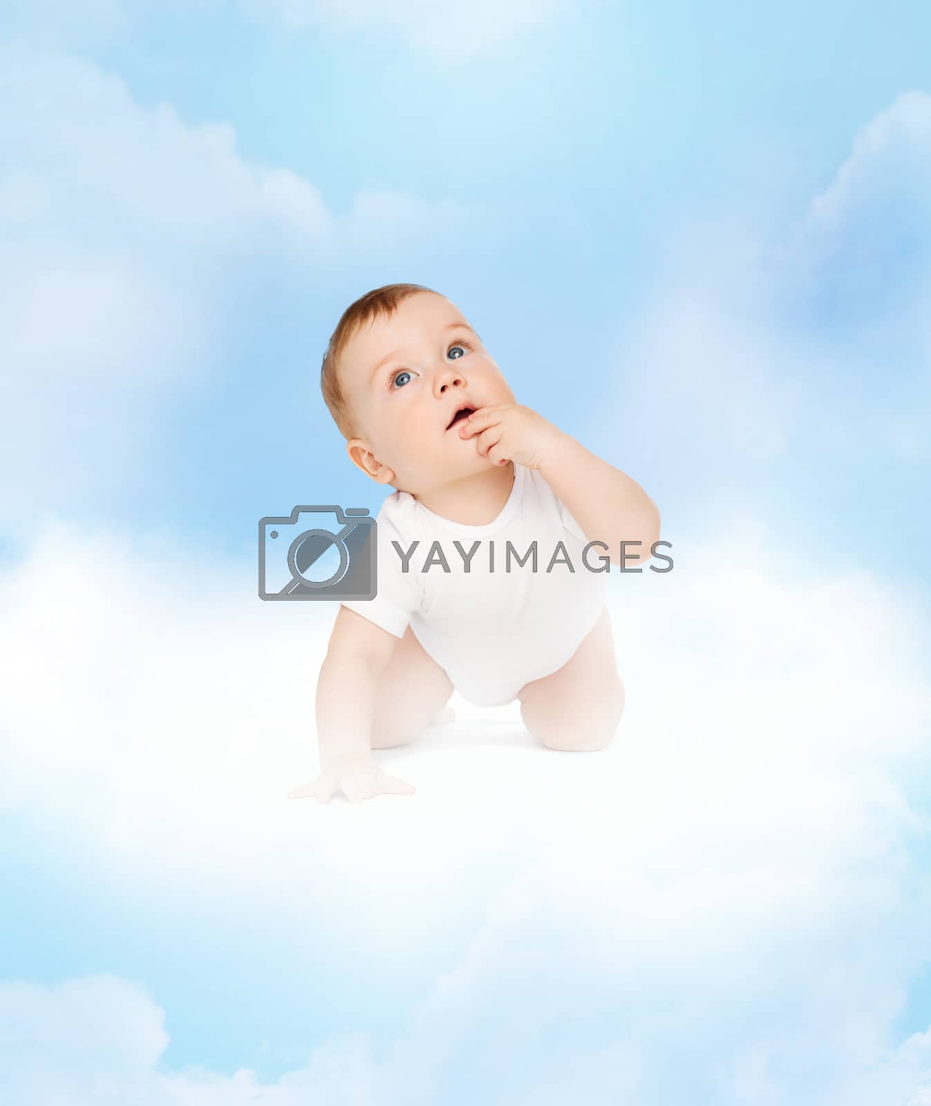 Royalty free image of crawling curious baby looking up by dolgachov