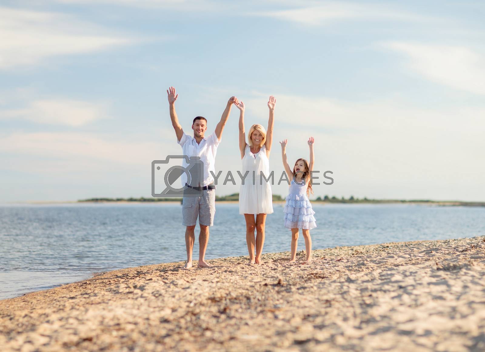 Royalty free image of happy family at the seaside by dolgachov