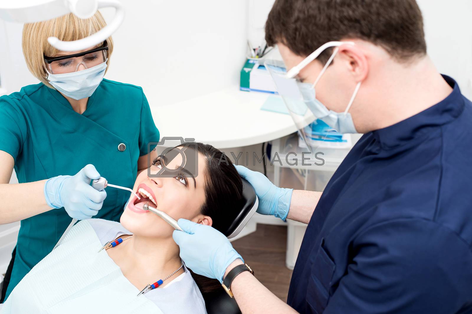 Royalty free image of Young woman undergoing a dental check by stockyimages