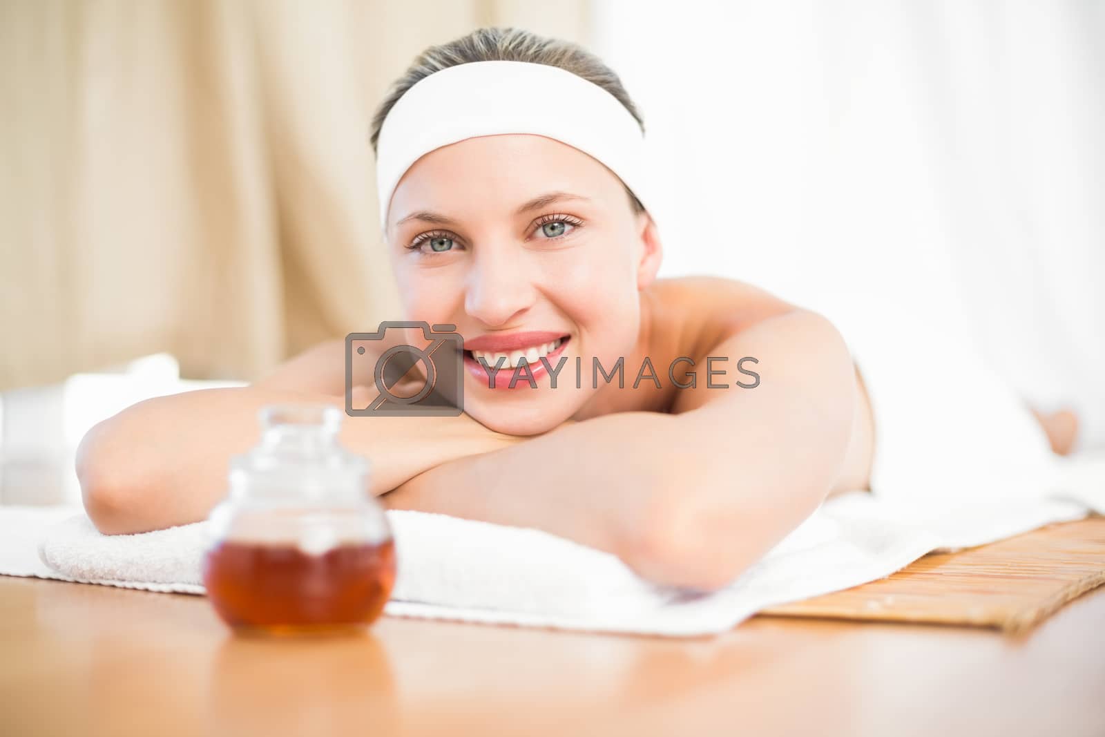 Royalty free image of woman next to the wax  by Wavebreakmedia