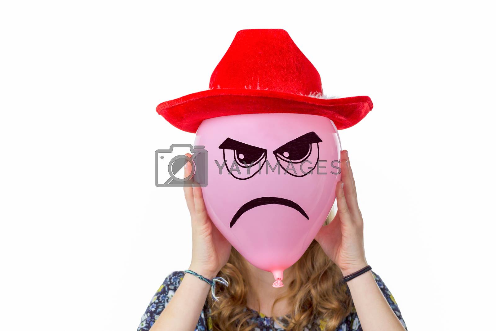 Royalty free image of Girl holding pink balloon with angry face and red hat by BenSchonewille